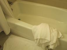 a bathtub with a towel on it
