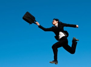 a woman in a suit jumping in the air