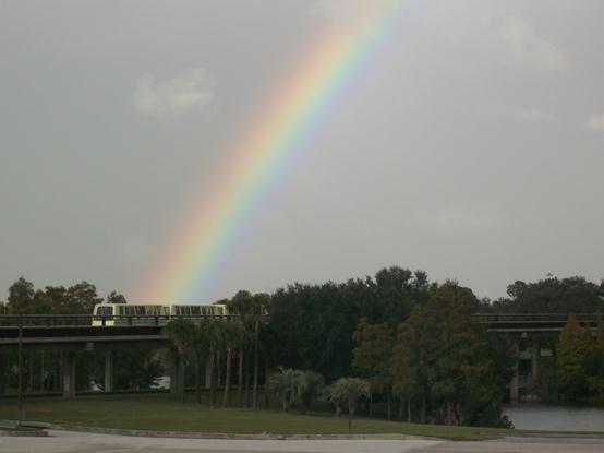 a rainbow over a bridge
