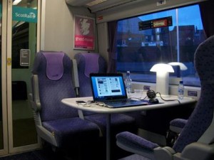 a laptop on a table in a train