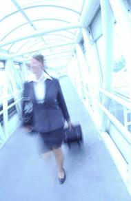 a blurry image of a woman walking