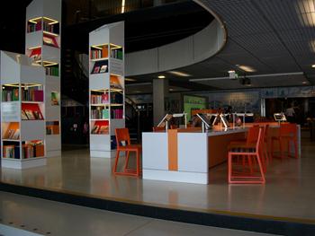 a library with a few bookshelves
