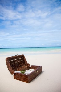 a wooden chest on a beach