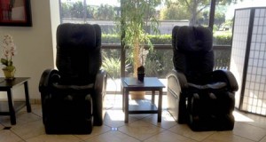 a pair of reclining chairs in front of a window