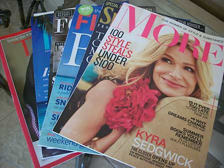 a stack of magazines on a table