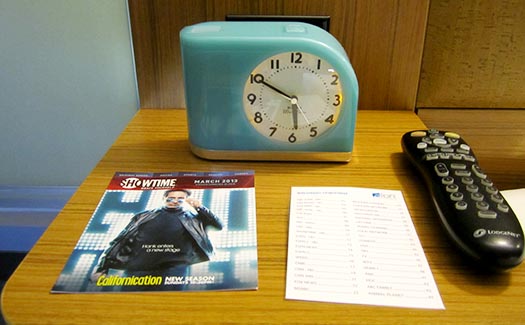 a clock and a magazine on a table