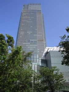 a tall building with trees in the background